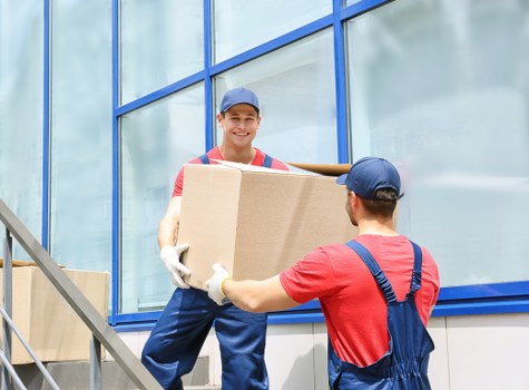 Removal team preparing household items for a UK move