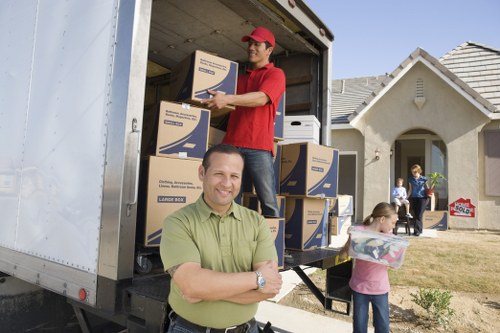 Professional movers handling furniture in a Fulham flat move
