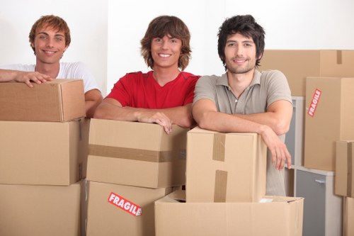 Packed moving boxes and furniture ready for transport in Fulham