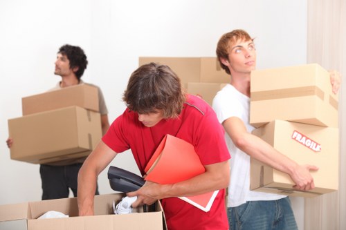 Moving van and home removal boxes in a Fulham residential street