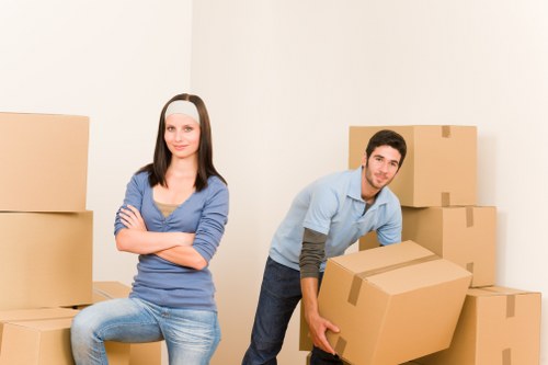 Worker using protective equipment while moving furniture